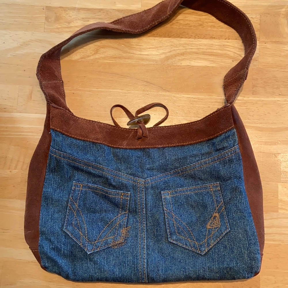 Roxy denim with brown suede hand bag/purse.